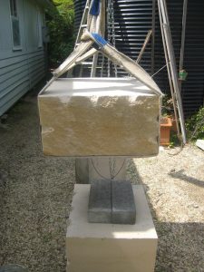 Lifting a block of sandstone