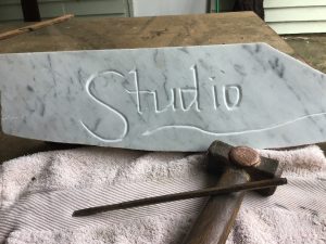 Hand lettering in stone